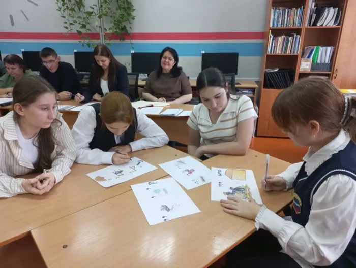 команда девочек разгадывает ребуся